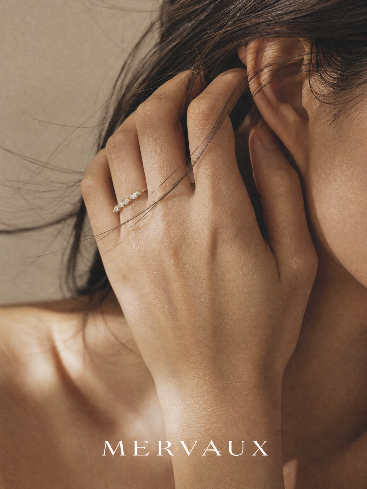 A marquise diamond band in solid 14K yellow gold, set low enough to sit flush against another ring.