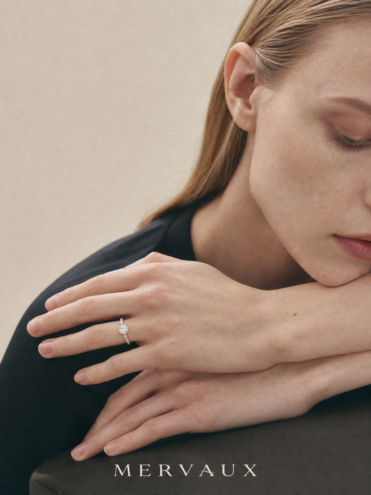 A Platinum 950 ring on resting hands, a metal that is white all the way through rather than plated to look it.