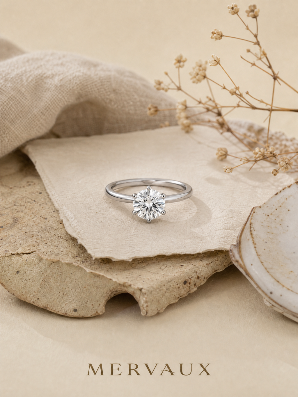 MERVAUX platinum solitaire, still life on stone and linen