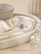 MERVAUX blue oval three-stone diamond ring, still life