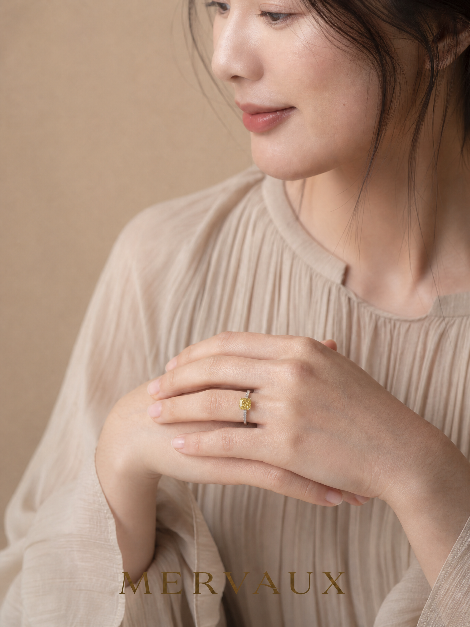 MERVAUX yellow diamond two-tone ring worn, hands folded