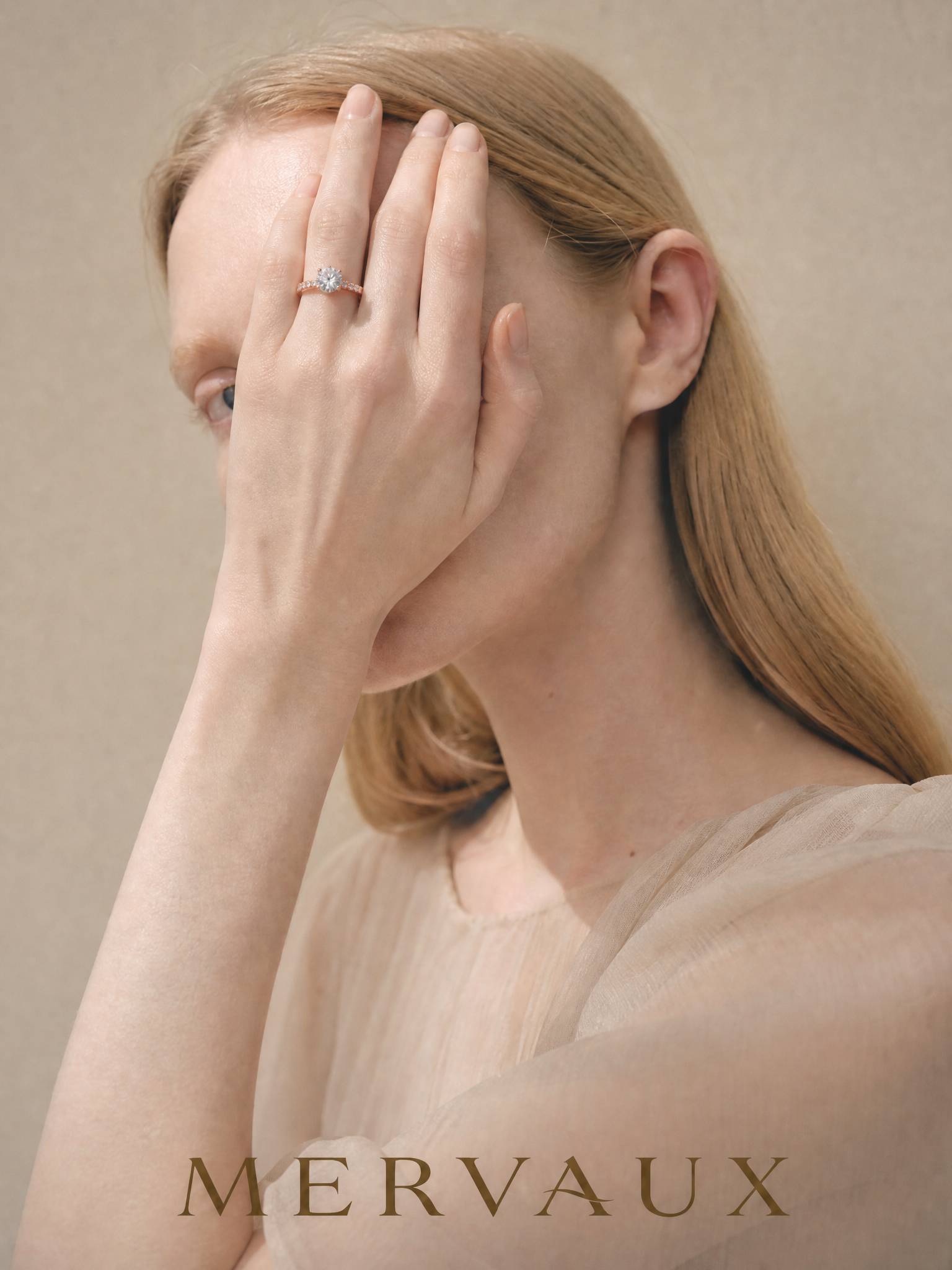 MERVAUX rose gold diamond ring worn, hand raised to brow