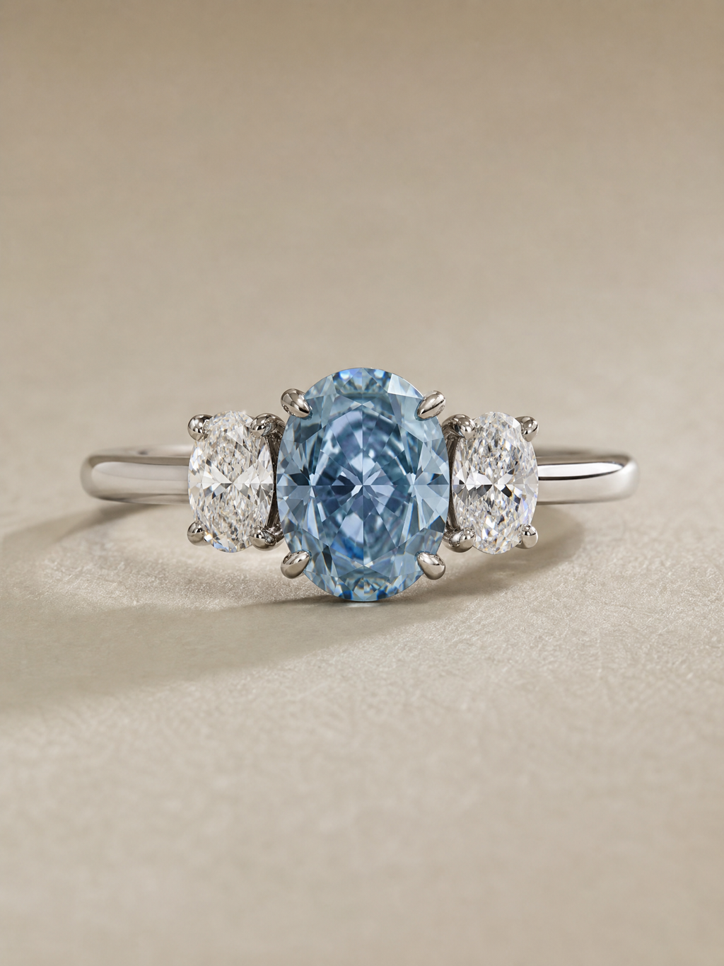 MERVAUX 3.04 ct fancy intense blue oval three-stone diamond ring in white gold - front view
