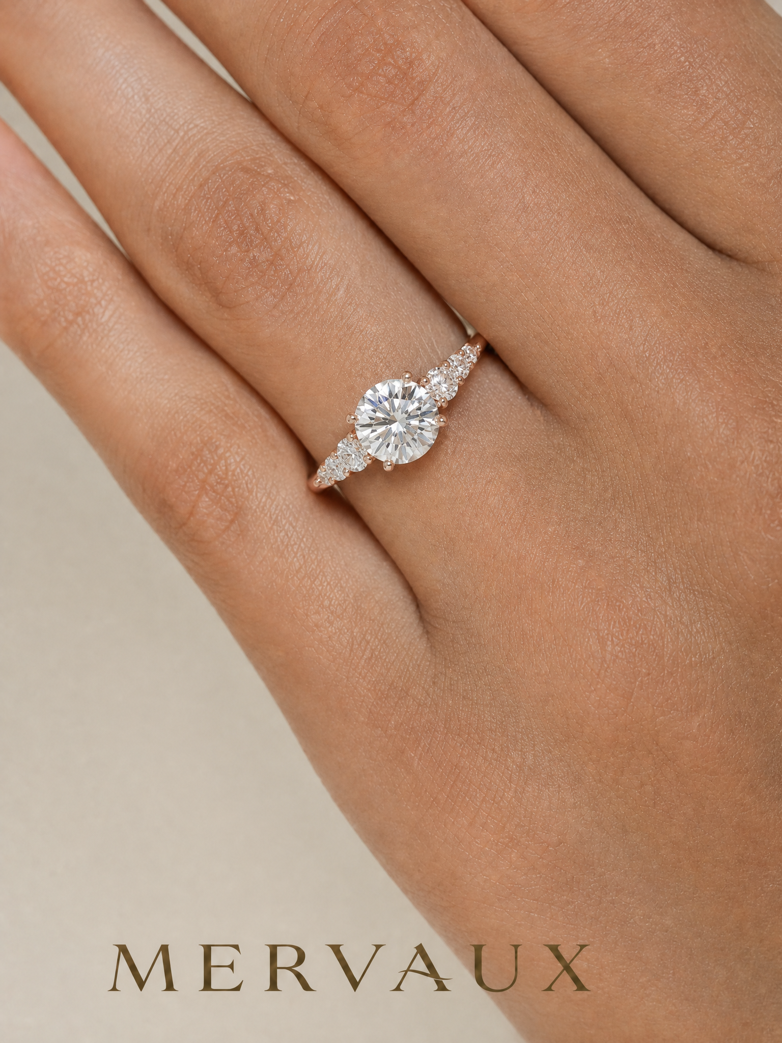 MERVAUX rose gold round brilliant diamond ring worn on hand, true to scale