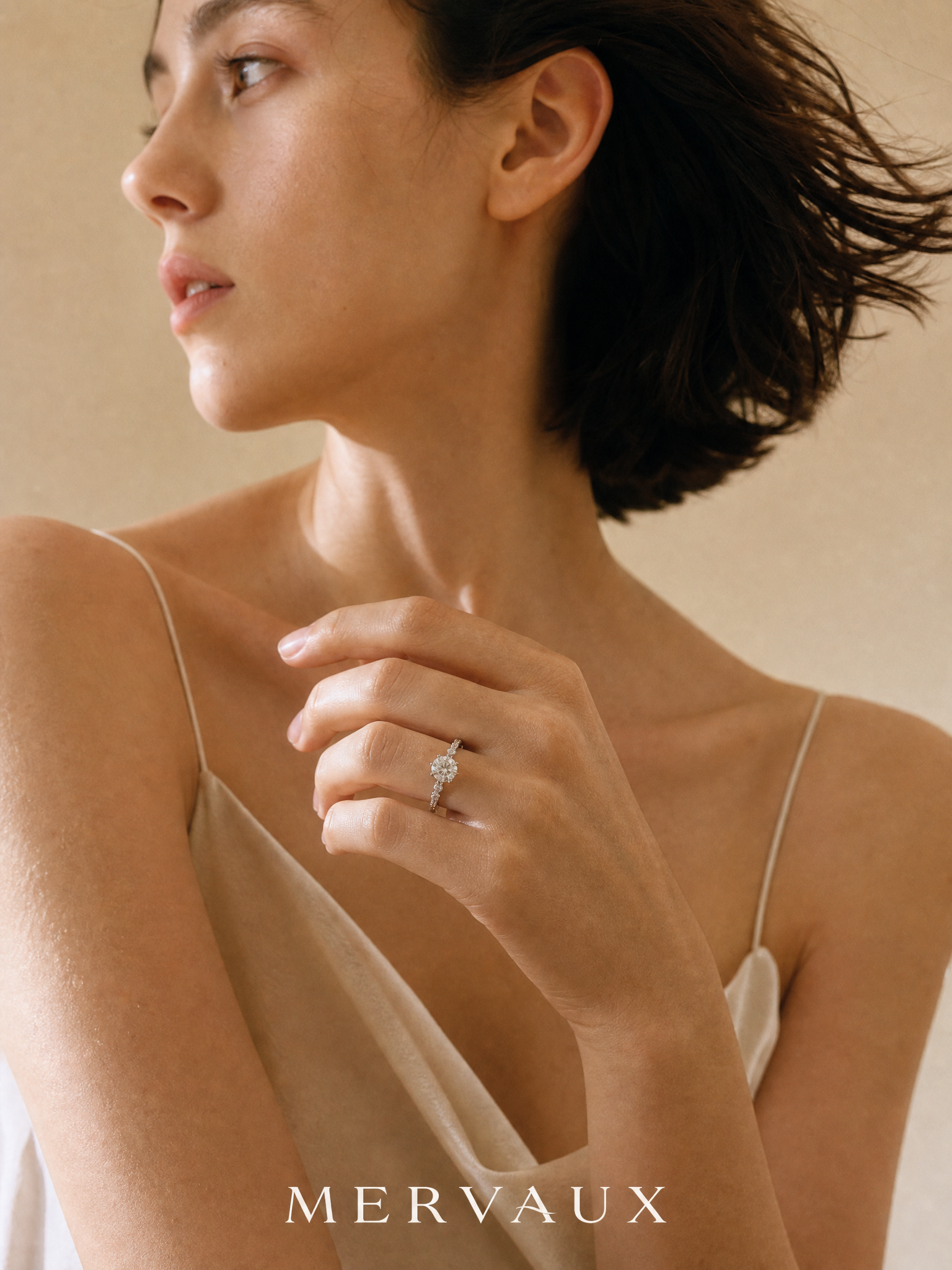 MERVAUX platinum ring worn, model in motion