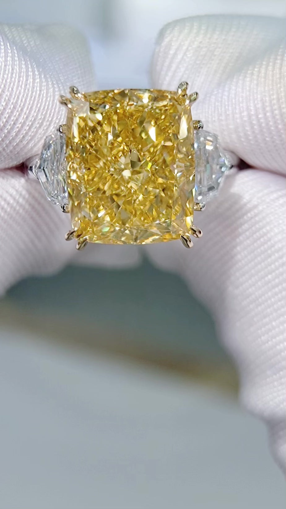 10.15 ct fancy vivid yellow radiant cut lab grown diamond ring turning in the hand